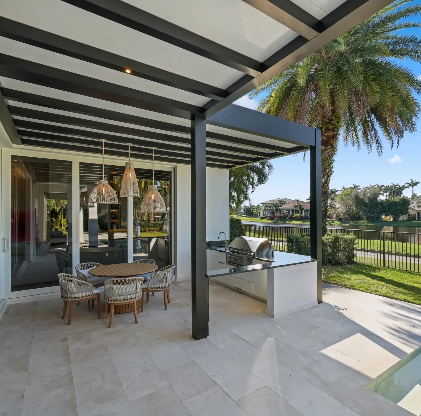R-SHADE insulated patio cover with white roof panels and recessed lighting