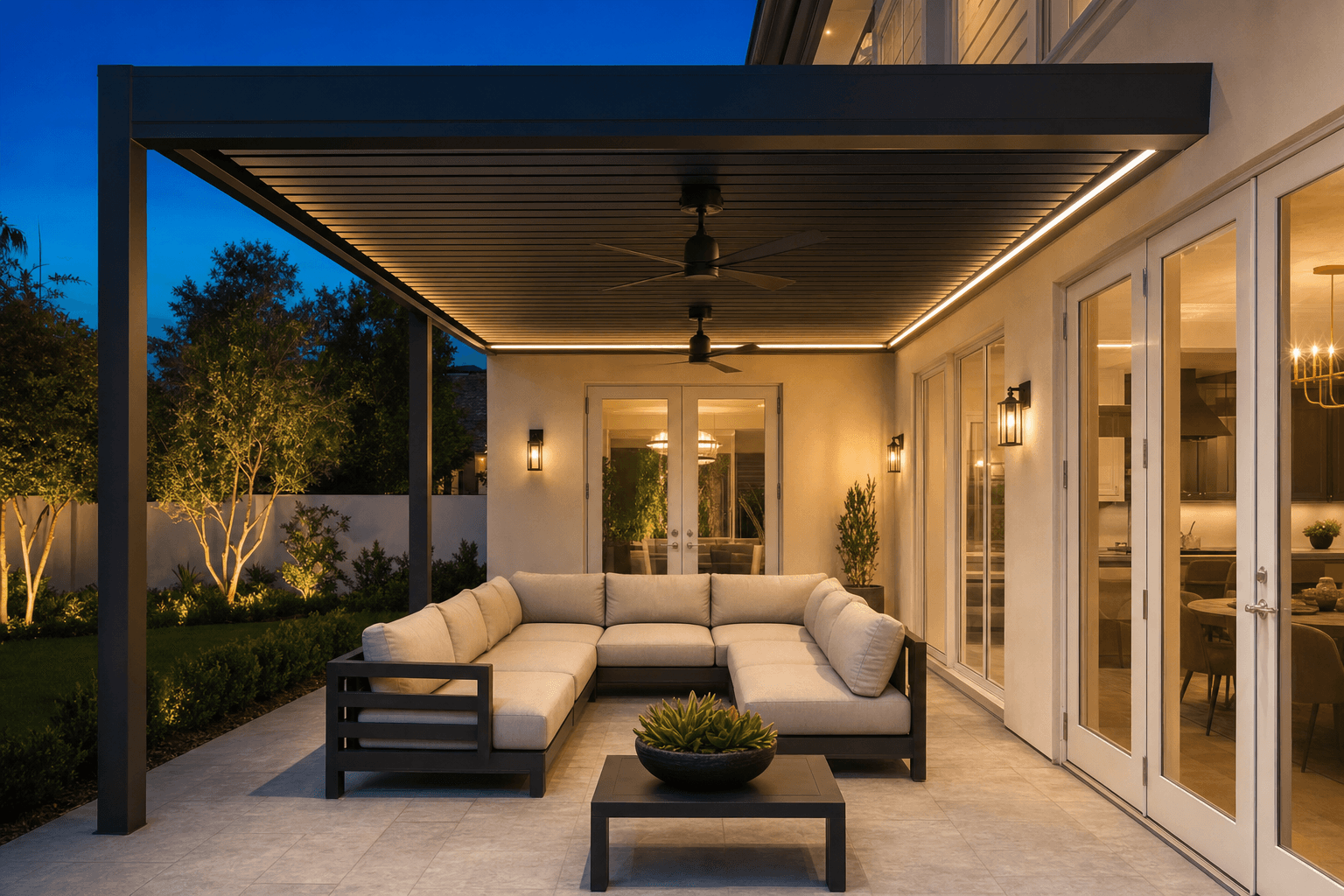 Luxury outdoor living space with a louvered pergola, integrated lighting, and patio seating at dusk