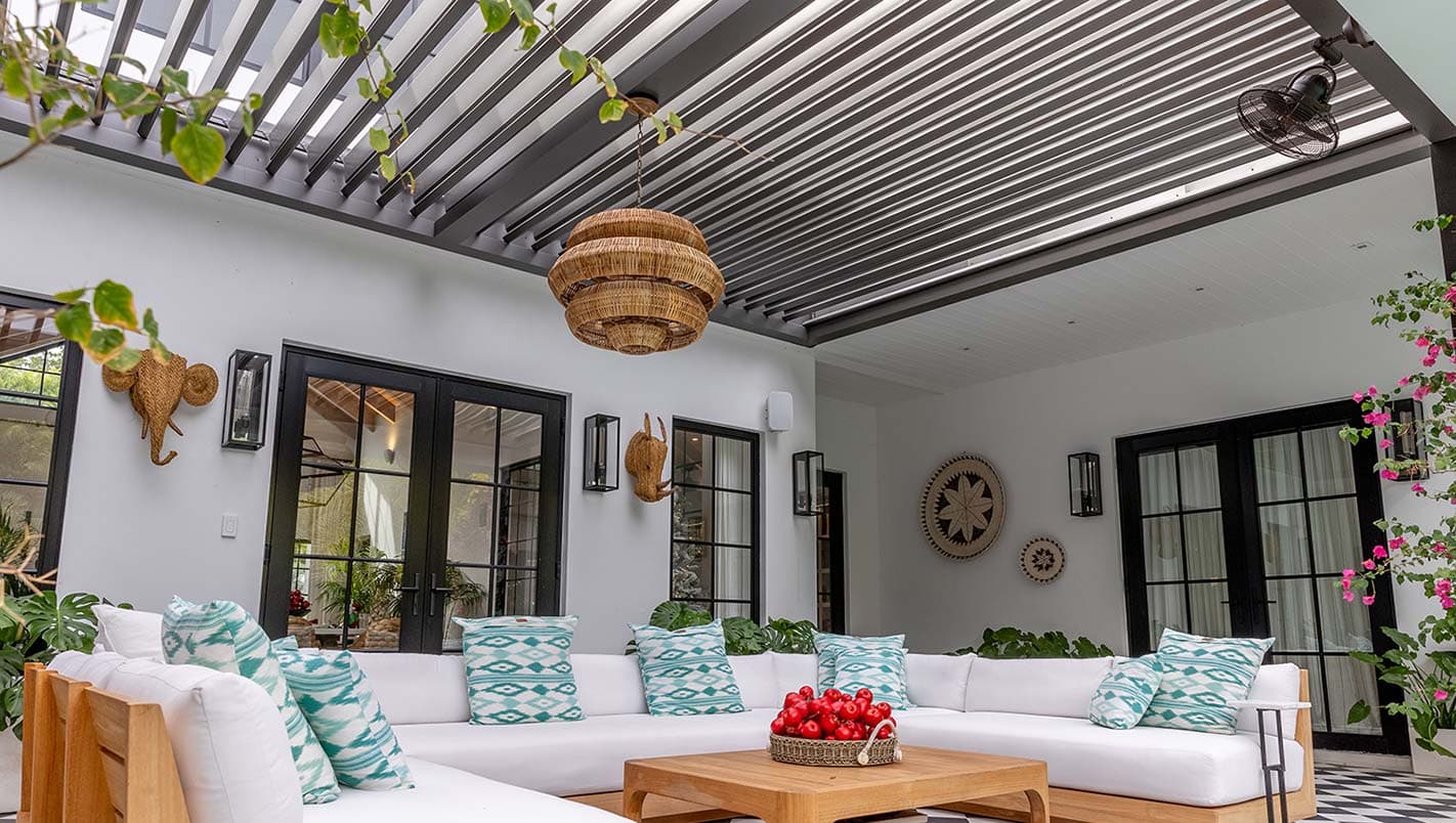 Motorized louvered pergola over a modern patio